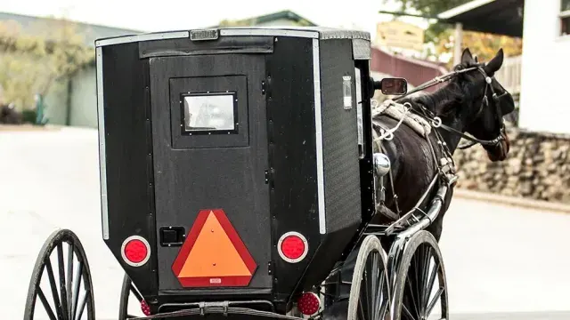 Slow moving vehicle sign